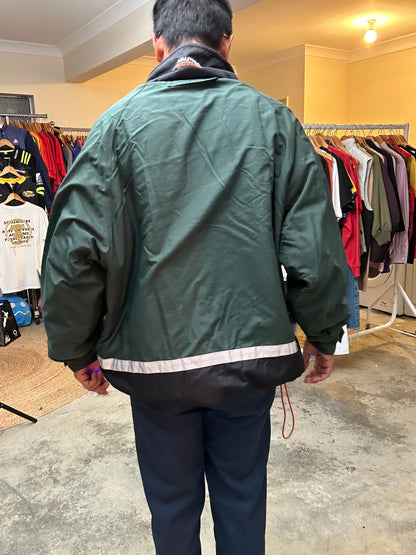 vintage Nautica Competition pullover jacket featuring a green nylon shell with a grey fleece lining and orange accents XL