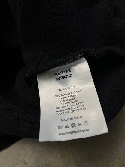 black Subtype Curated hoodie features a prominent kangaroo pocket and a clean, minimalist design Small