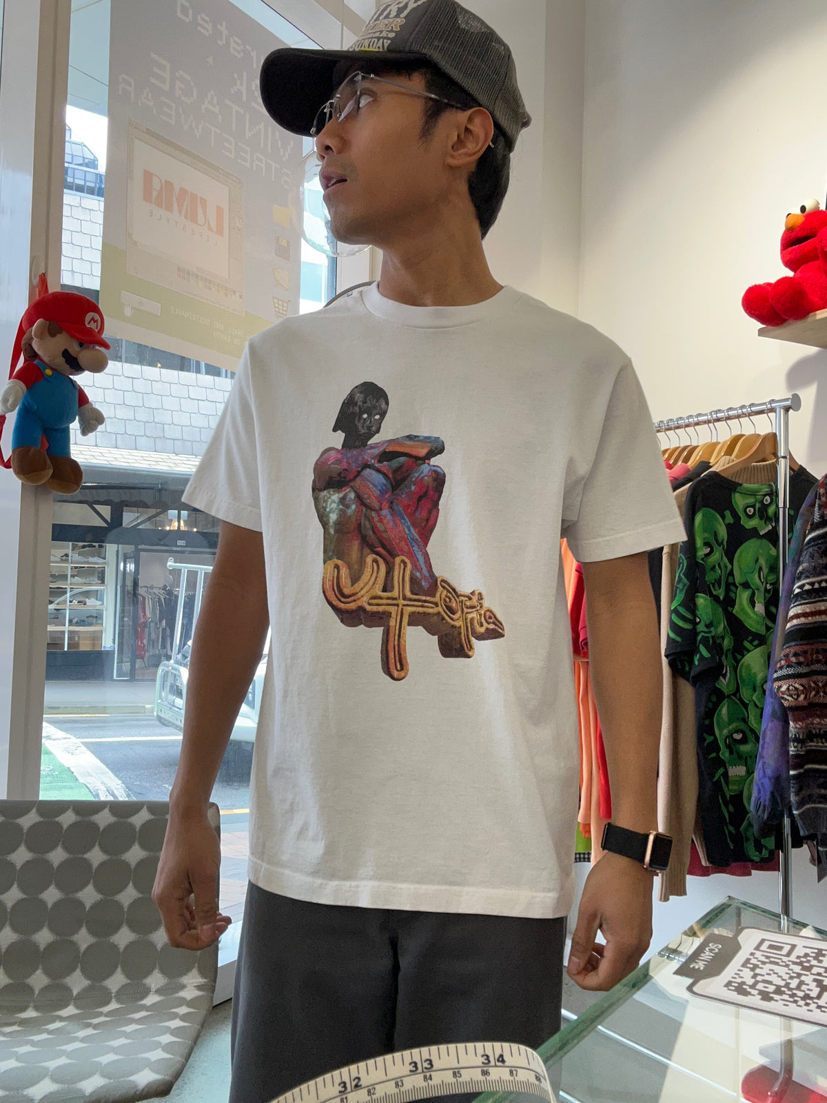 white Travis Scott Utopia B1 Tee featuring a colorful abstract graphic and the word "utopia" on the chest Medium