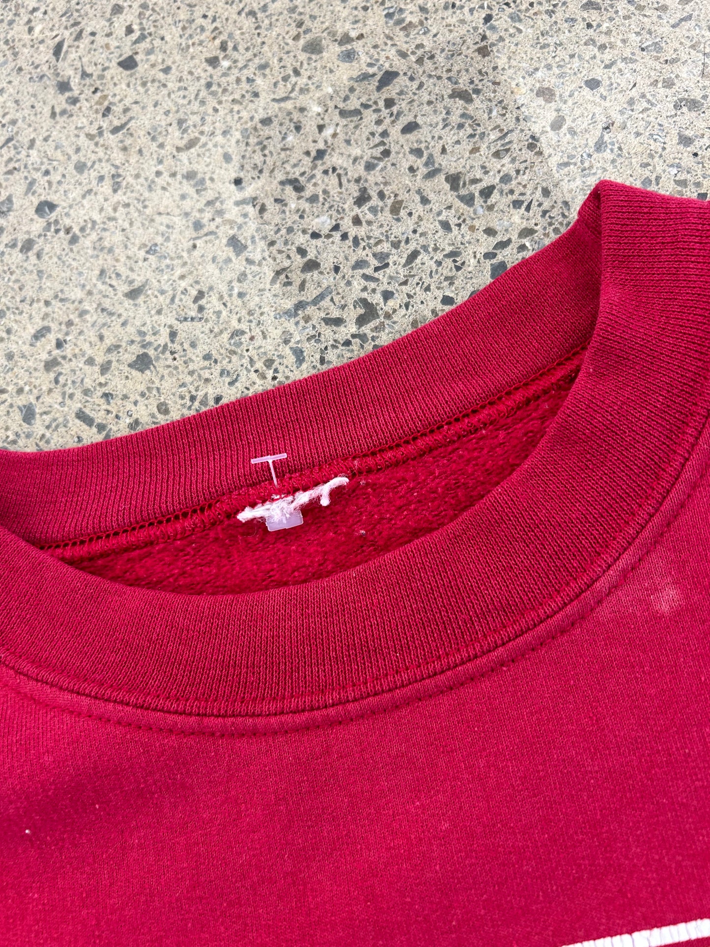 Vintage red crewneck sweatshirt features an Iowa State University graphic with the mascot Cy Medium