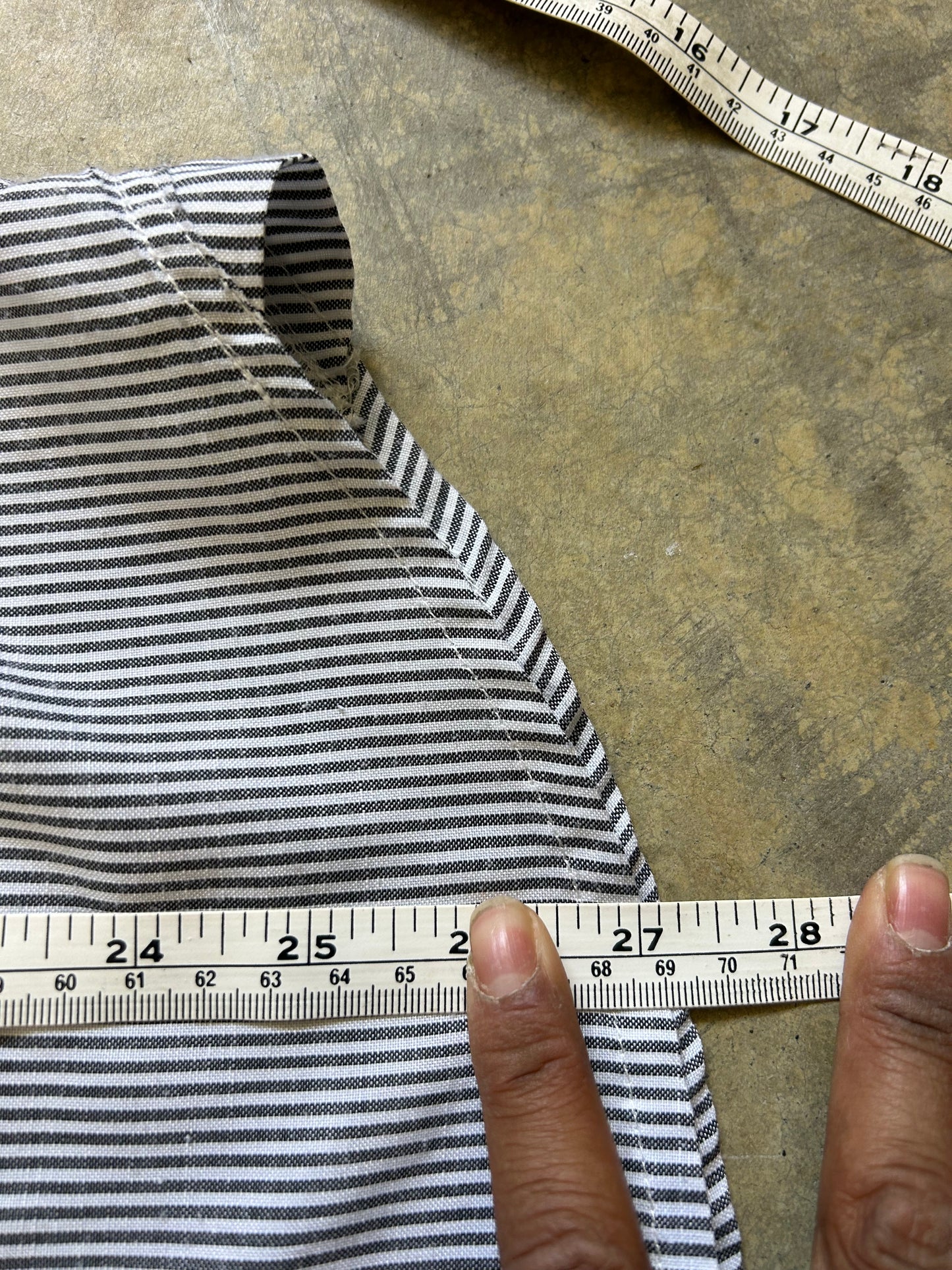 short-sleeve button-up shirt from the brand Stüssy, featuring a classic hickory stripe pattern and dual chest pockets.Medium
