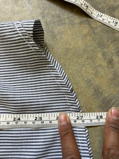 short-sleeve button-up shirt from the brand Stüssy, featuring a classic hickory stripe pattern and dual chest pockets.Medium