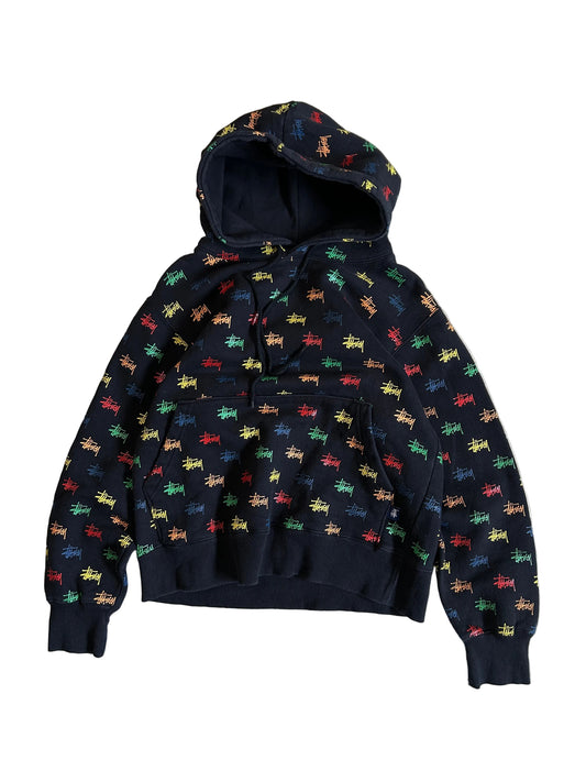 black, pullover-style hoodie featuring an all-over, multi-colored Stüssy logo print Small