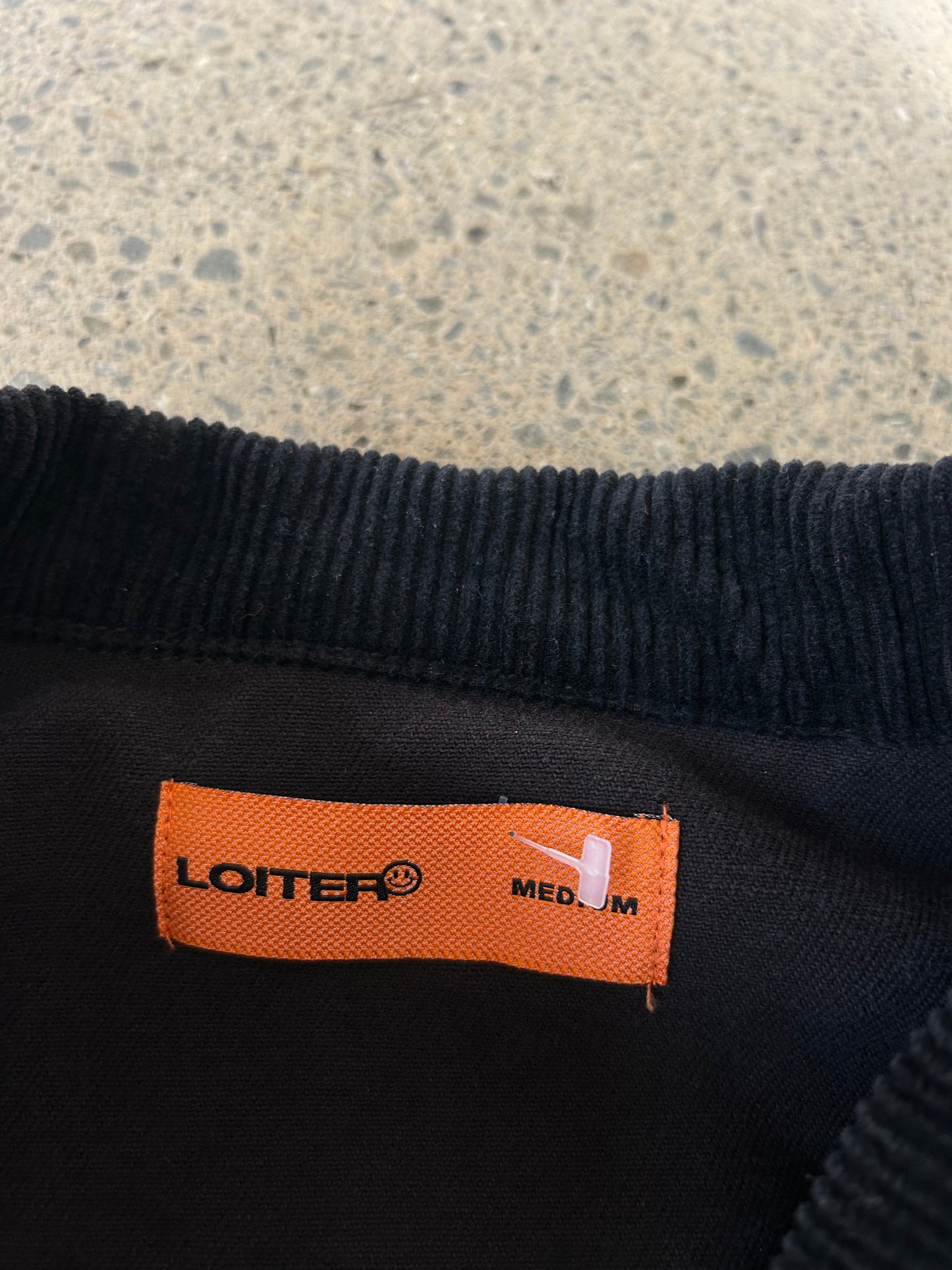 Loiter skeleton zip-up jacket in black, featuring a prominent ribcage graphic and a red heart detail Medium