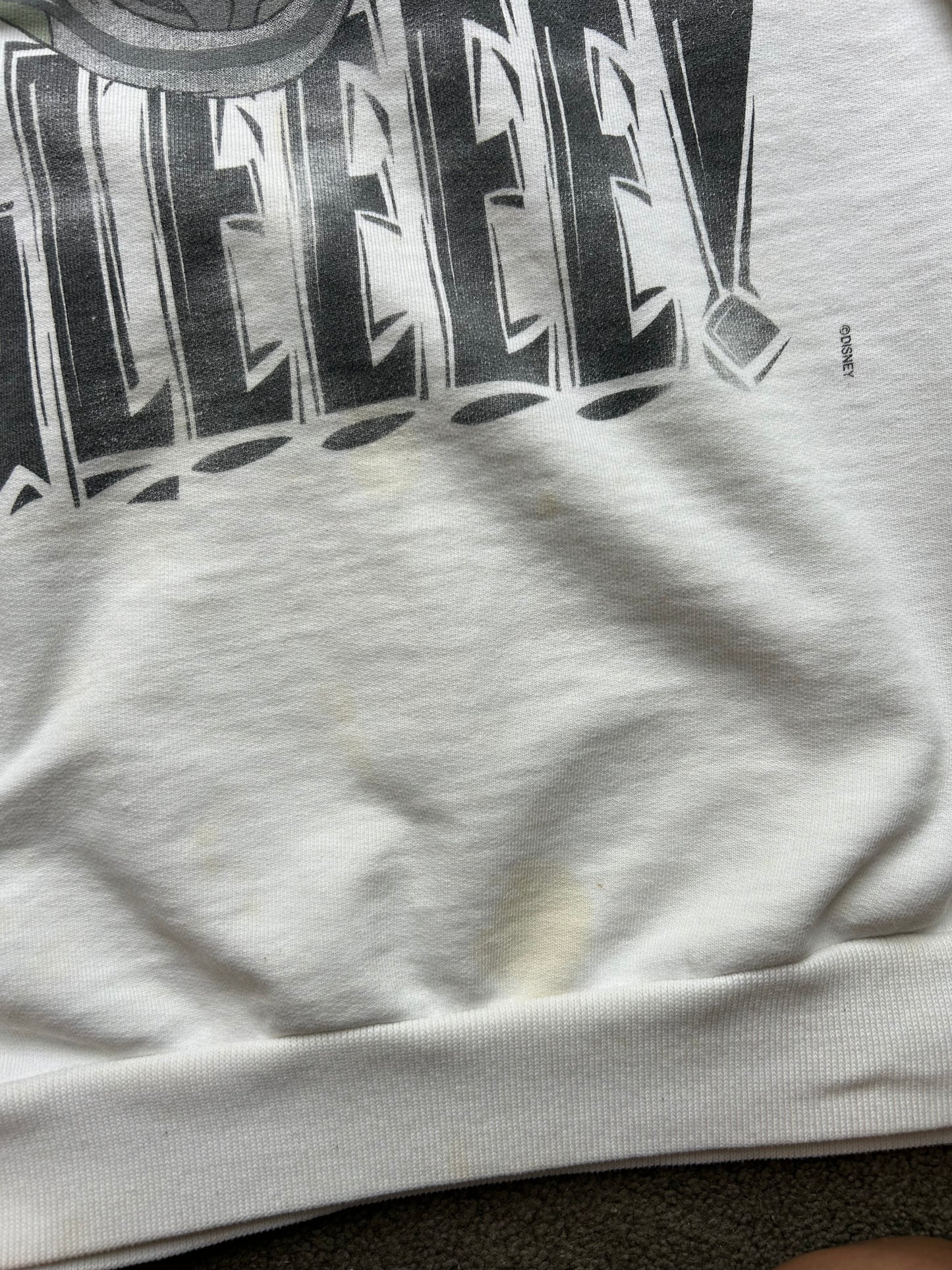 vintage white crewneck sweatshirt features a large graphic of Ed the hyena from The Lion King with the text "MAN ARE YOU UGLEEEE Large