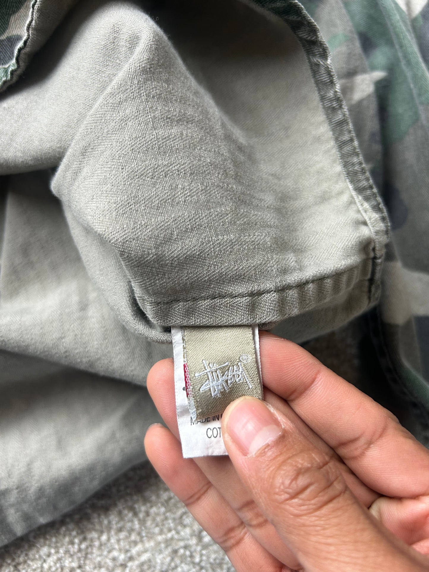 Stussy camouflage cargo shirt featuring a button-up front and a logo patch on the chest Medium