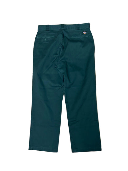 Vintage green Dickies 874 Original Fit Work Pants, recognized by their iconic tunnel belt loops and straight-leg cut 34