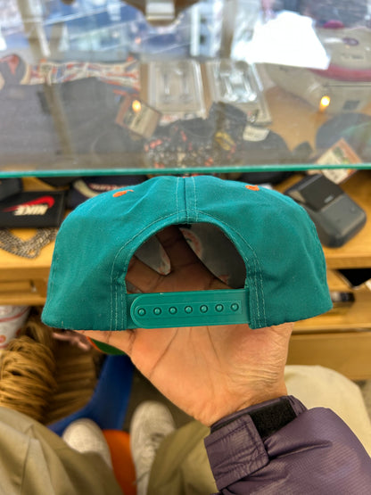 vintage Miami Dolphins snapback hat features a distinctive orange brim contrasting with a teal crown
