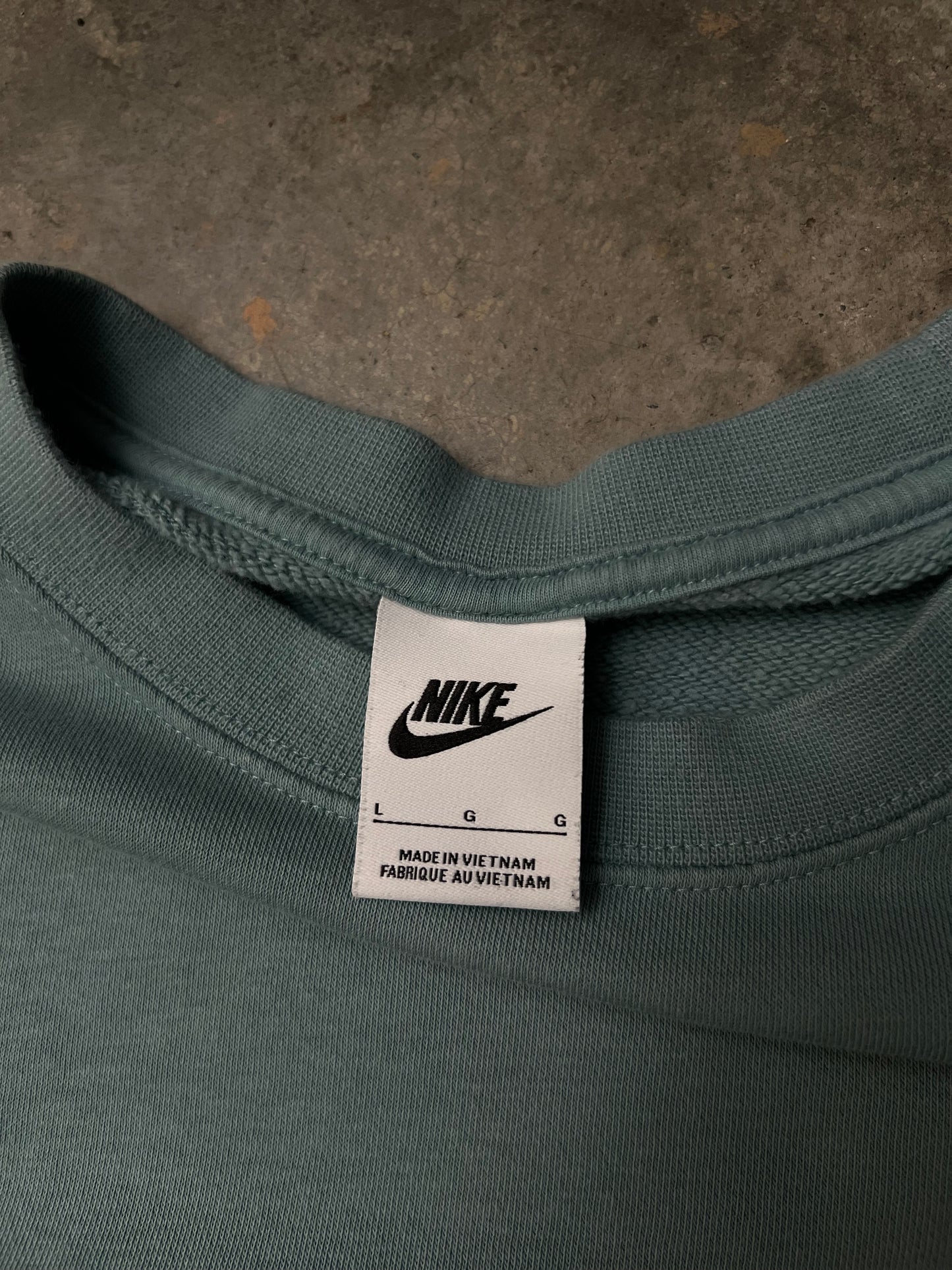 green Nike Men's Sportswear Club Fleece Crew features a classic embroidered logo on the chest Large