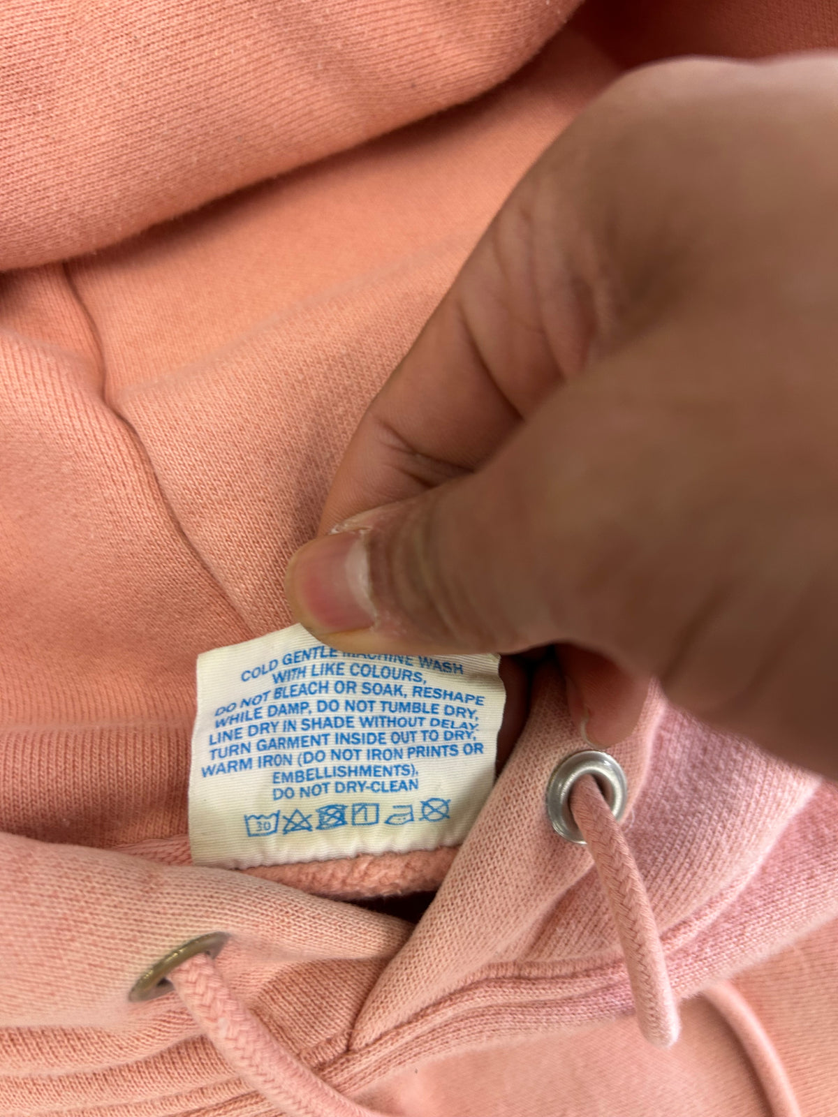 Champion Reverse Weave Small C Hoodie in a light pink or rose shade Medium