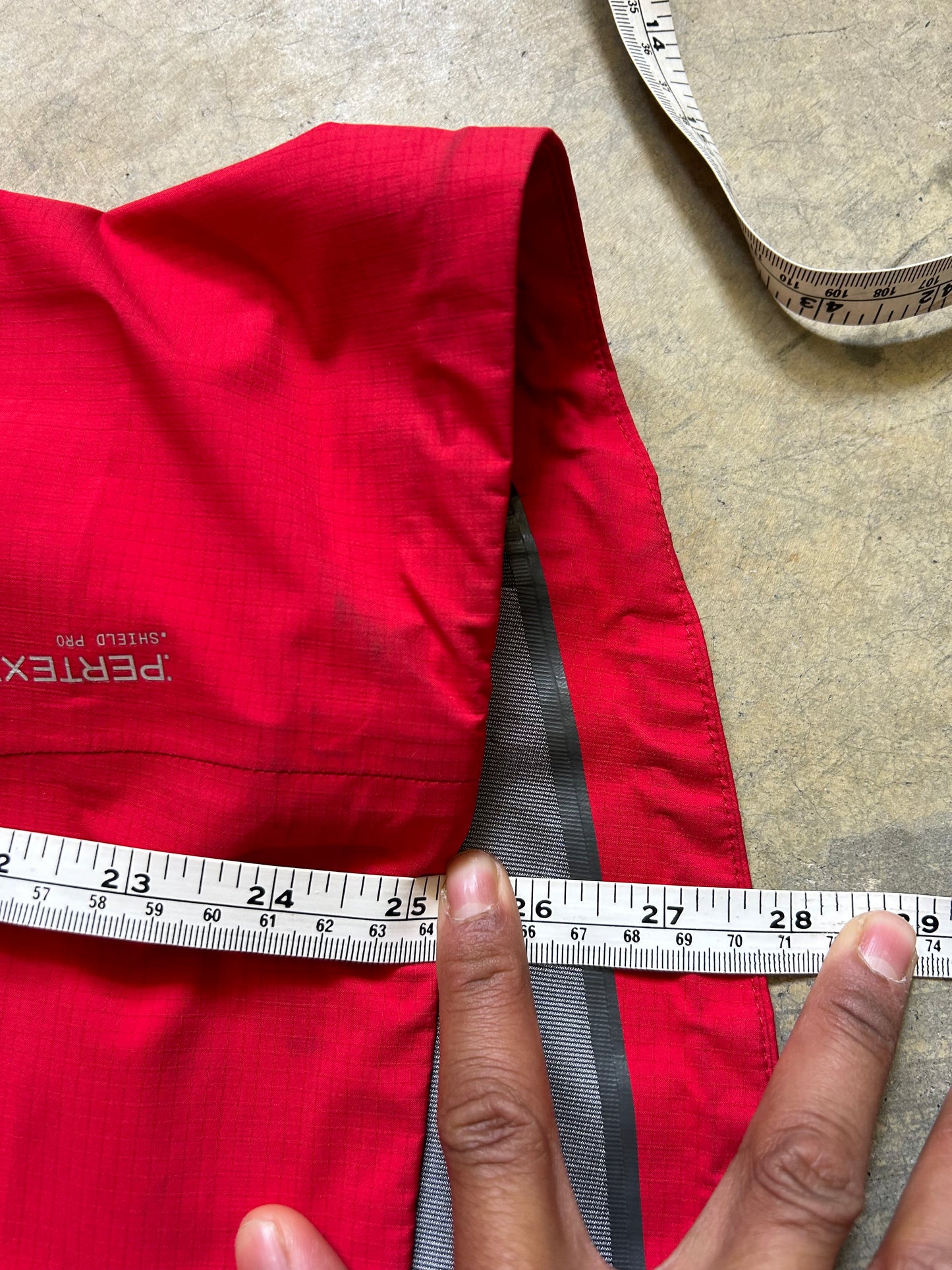 Macpac Lightweight Prophet Rain Jacket, a technical alpine hardshell designed for extreme conditions above the snowline Alpine Series Medium Red