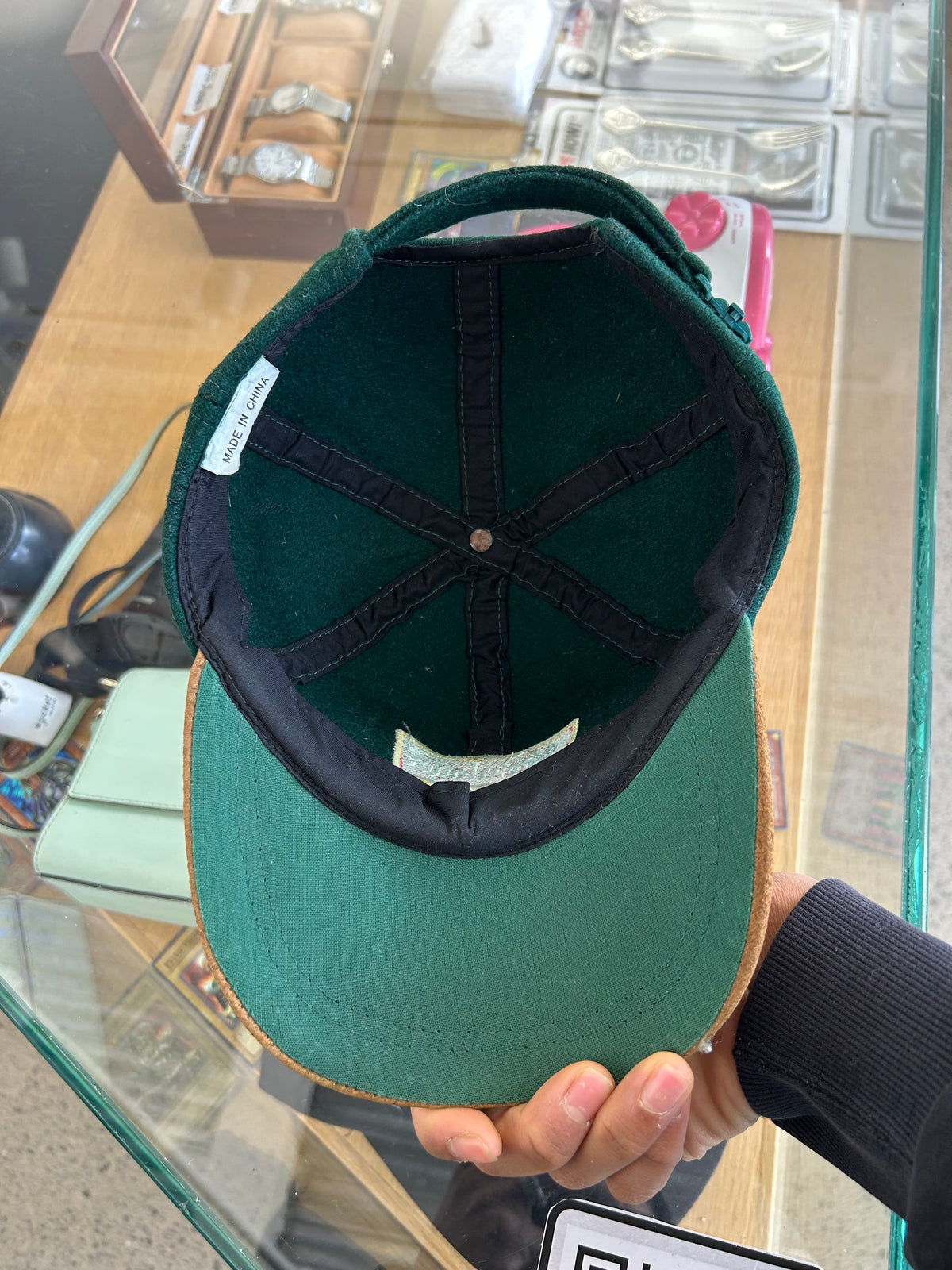 vintage Steinlager two-tone cap featuring a dark green crown and a contrasting tan brim