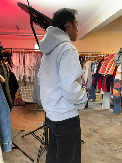 heather grey hoodie from Lower features a central "Lower" graphic of a hand on a vinyl record with star accents Medium