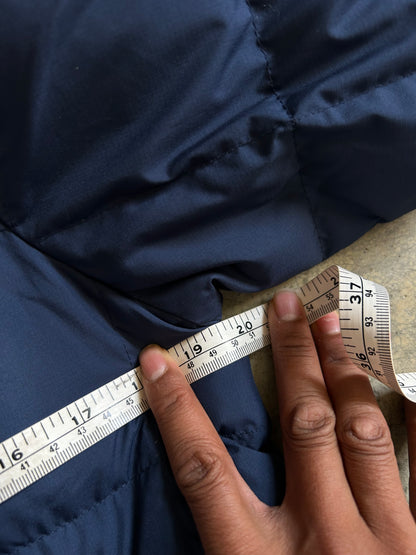 Pertex blue puffer jacket with a red inner lining and red zippers, produced by Levi's Small