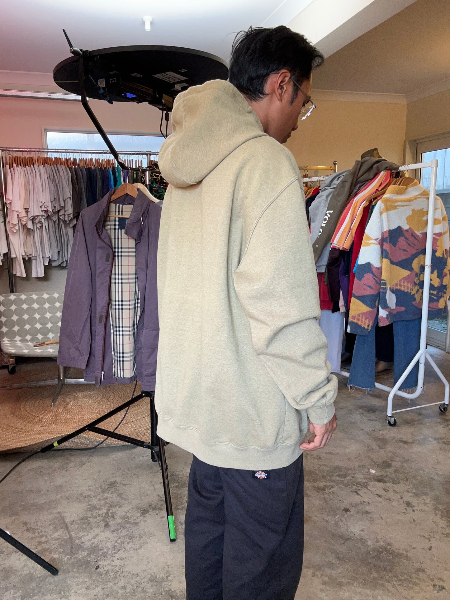 olive Carhartt K288 hooded sweatshirt features a "Carhartt" graphic printed down the left sleeve XL