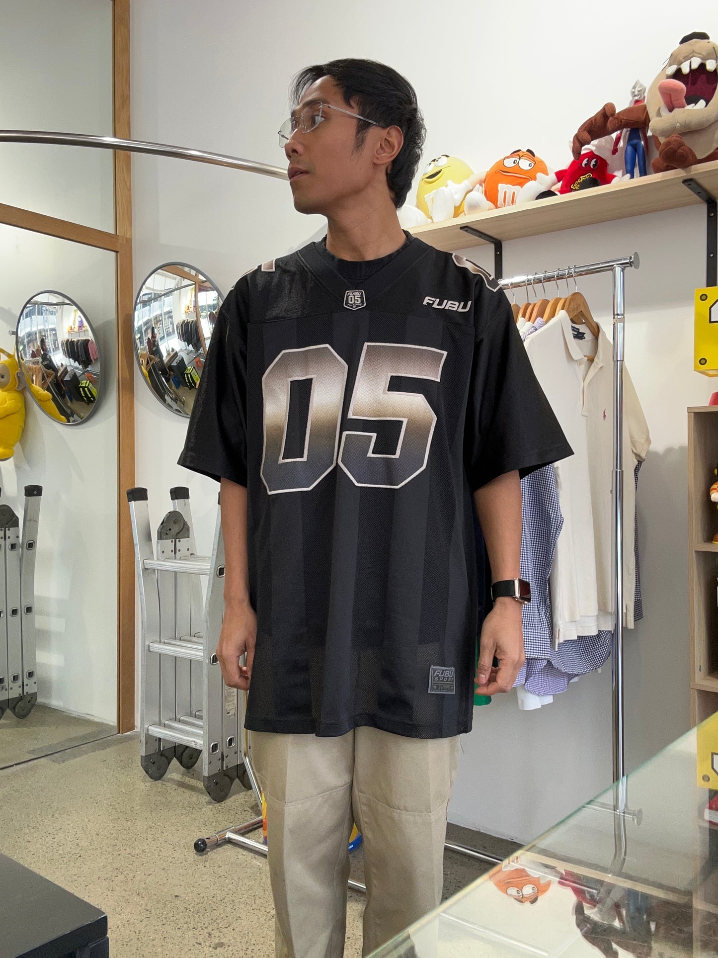 Vintage black FUBU Game Day jersey features gradient "05" numbering and embroidered branding Medium