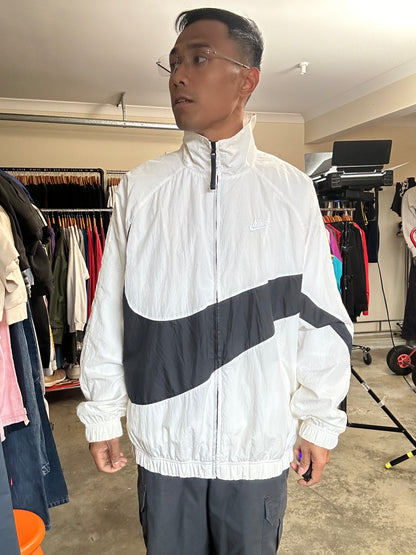 Nike Big Swoosh Woven Statement Jacket, often referred to as a windbreaker, which features a prominent large swoosh design XL White