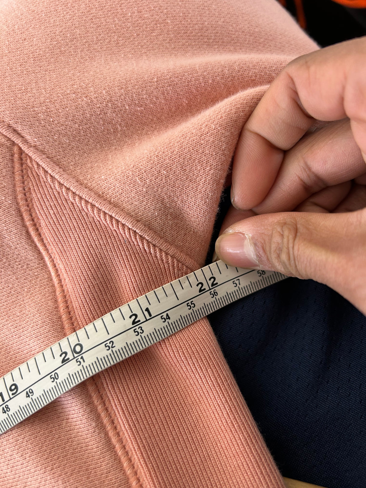 Champion Reverse Weave Small C Hoodie in a light pink or rose shade Medium