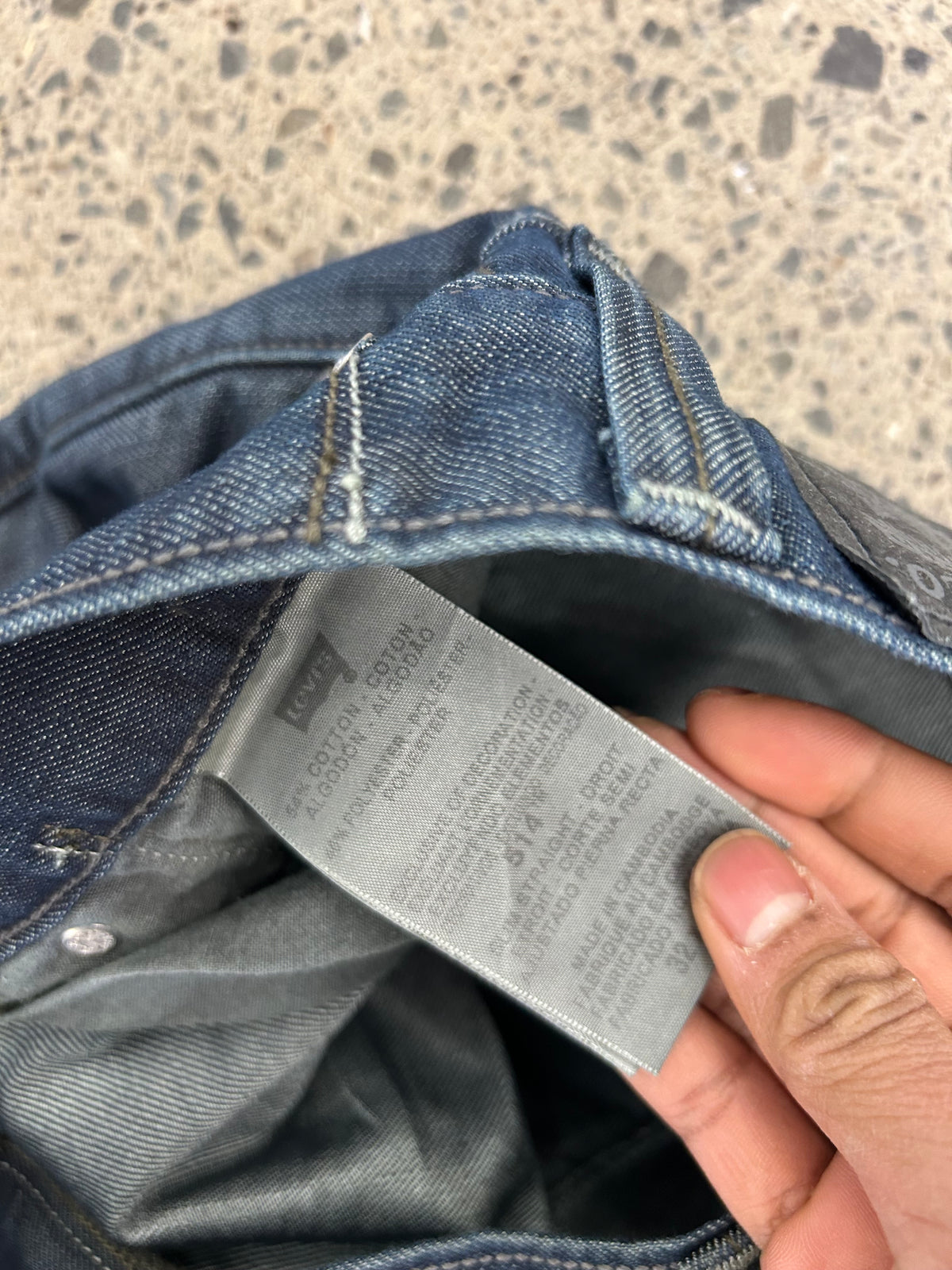 Levi's 514 Slim Straight Jeans featuring unique back flap pockets and a twisted seam design size 32