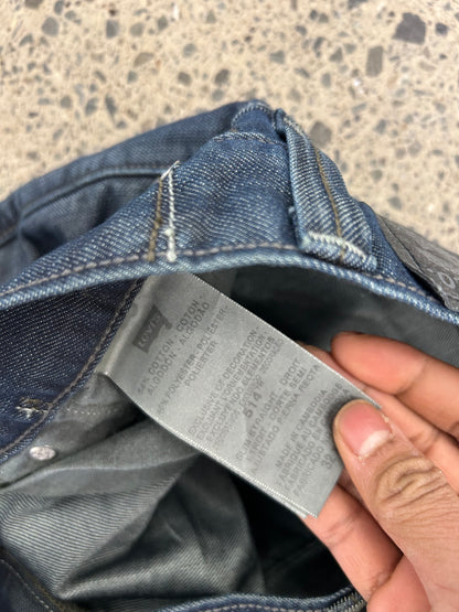 Levi's 514 Slim Straight Jeans featuring unique back flap pockets and a twisted seam design size 32