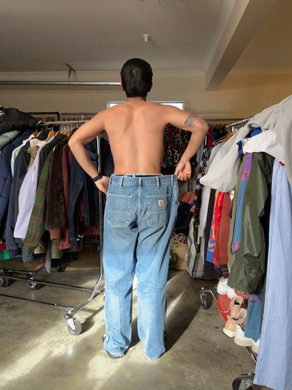 Carhartt WIP Simple Pants are rendered in a light blue stone-washed denim featuring the iconic square logo patch on the back pocket.Size 34
