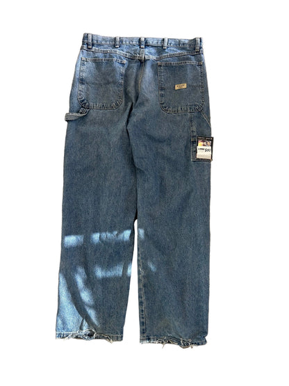 Wrangler carpenter pants feature a classic hammer loop and utility pockets on the side size 34 Blue