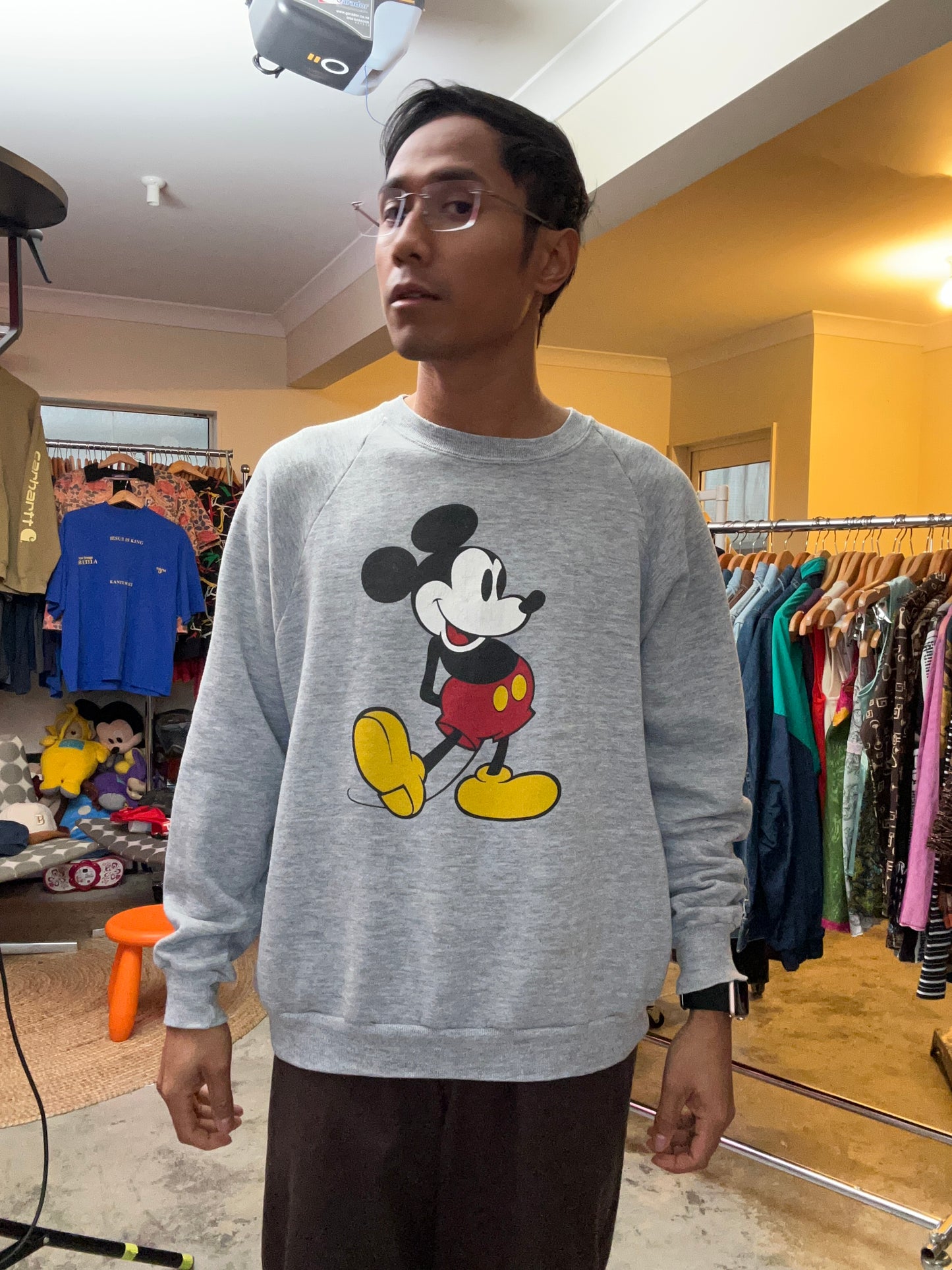 vintage 80s Disney Mickey Mouse sweatshirt features a heather gray design with raglan sleeves and a classic character graphic Large