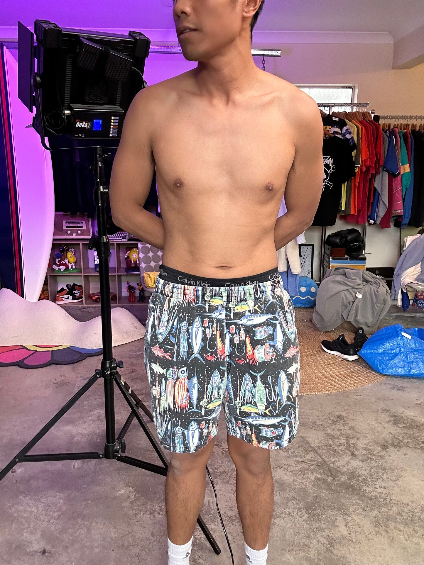 Stüssy beach shorts featuring an all-over fishing-themed graphic print size 34