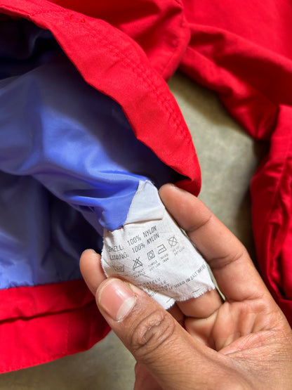 vintage Patagonia jacket, likely from the Fall Line collection, featuring a vibrant red shell and a purple collar Medium