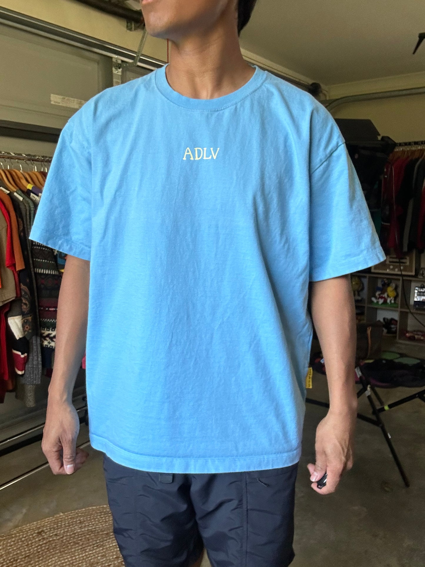 Acmé de la vie (ADLV) Glossy Basic Logo Short Sleeve T-Shirt in blue. Large