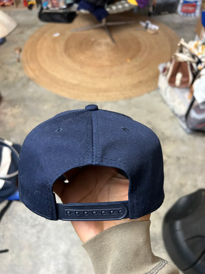dark navy Harley-Davidson baseball cap features a prominent embroidered bar and shield logo on the front OSFa