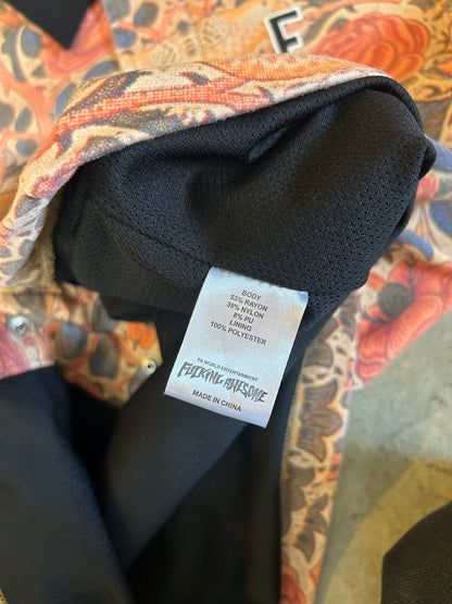 F*cking Awesome Warm Up Top featuring an all-over floral print. Medium Orange