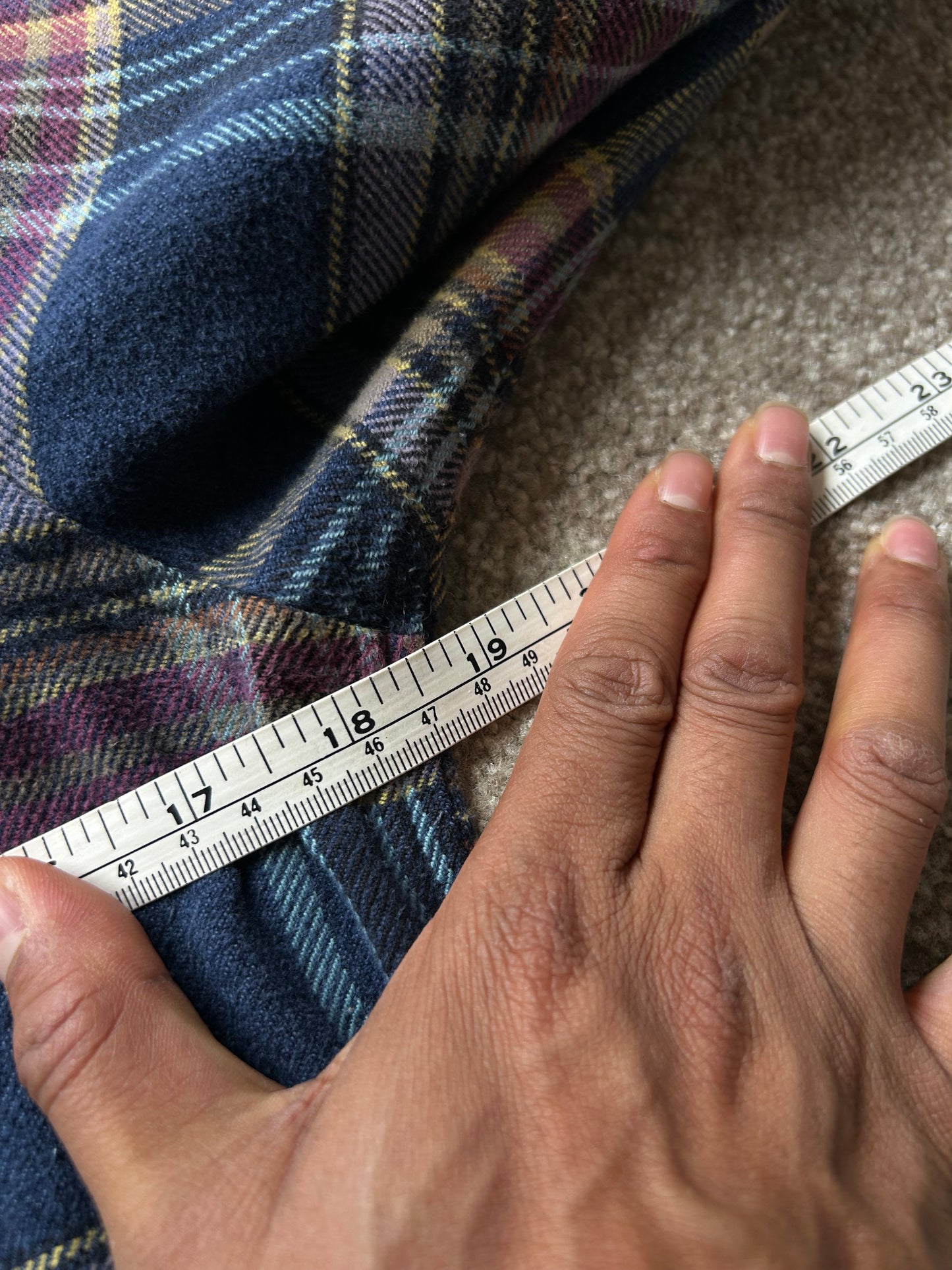 Patagonia Women's Long-Sleeved Fjord Flannel Shirt in a blue and purple plaid pattern, made from 100% organic cotton