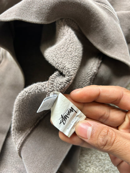 Stüssy 8 Ball Pigment Dyed Hoodie in a brown/taupe color, made from heavy cotton fleece