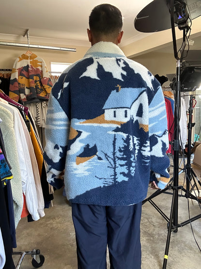 Kith Lakeside Claremont Sherpa Quarter Zip in the Summit colorway, featuring a graphic lakeside scene and a branded quarter-zip closure XL Blue