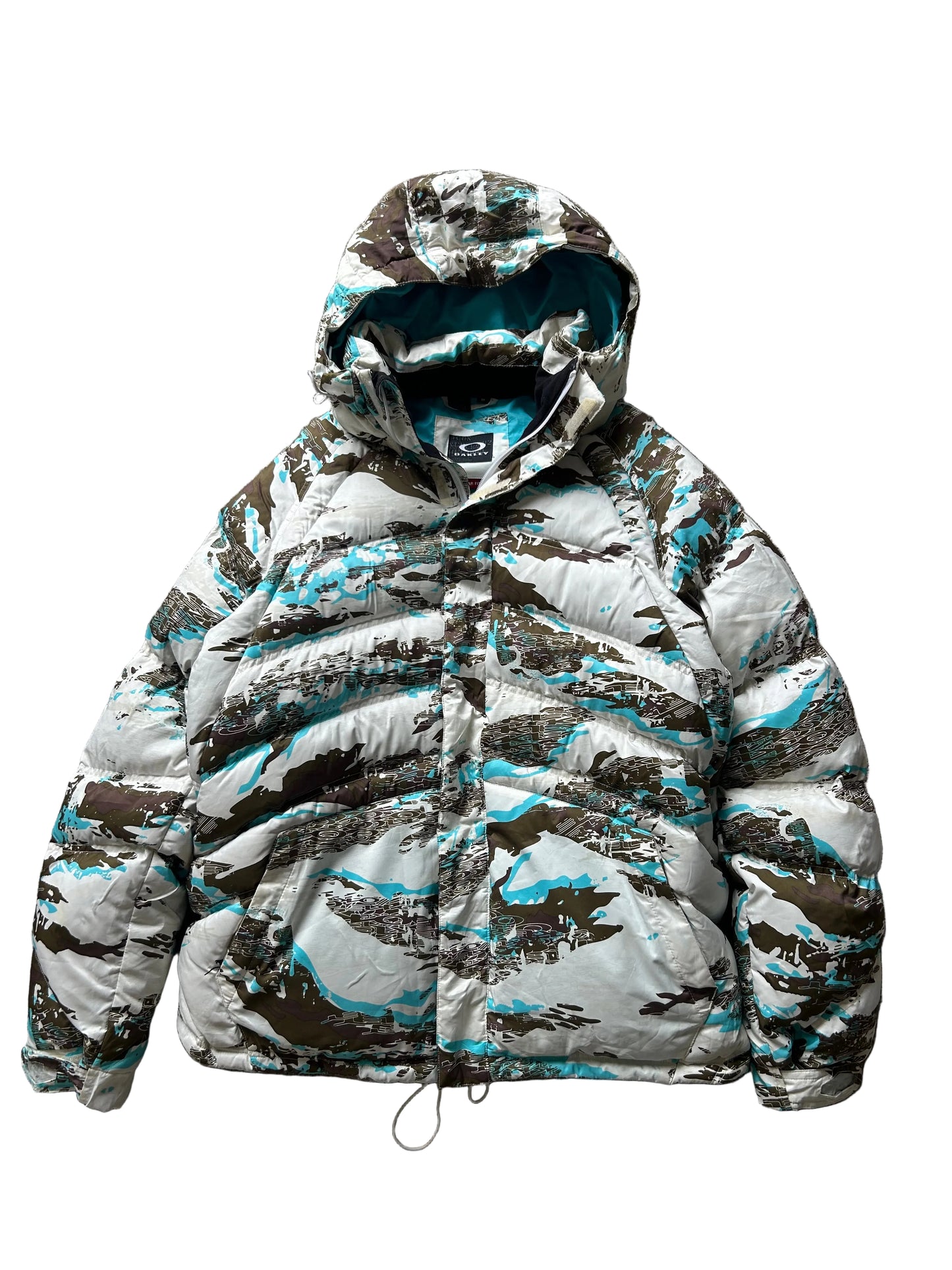 Oakley Avalanche NVL4 snow jacket in a white, brown, and blue camouflage pattern Large