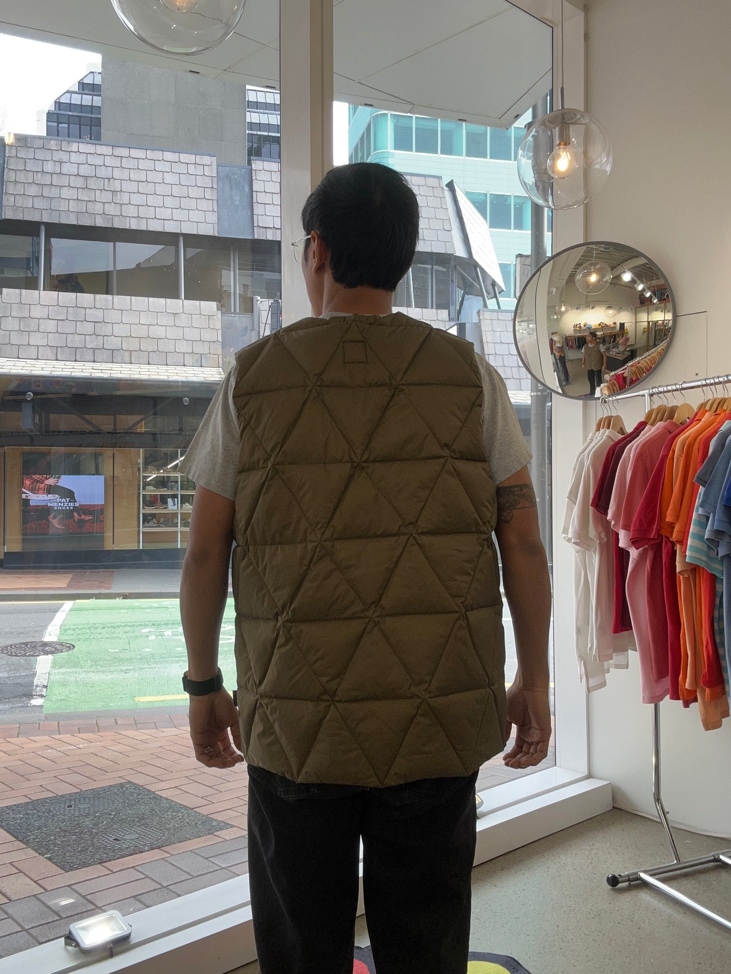 Holden Pyramid Down Vest in a brown olive color, featuring a unique triangular quilted pattern. Large