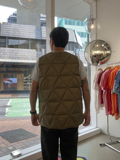 Holden Pyramid Down Vest in a brown olive color, featuring a unique triangular quilted pattern. Large