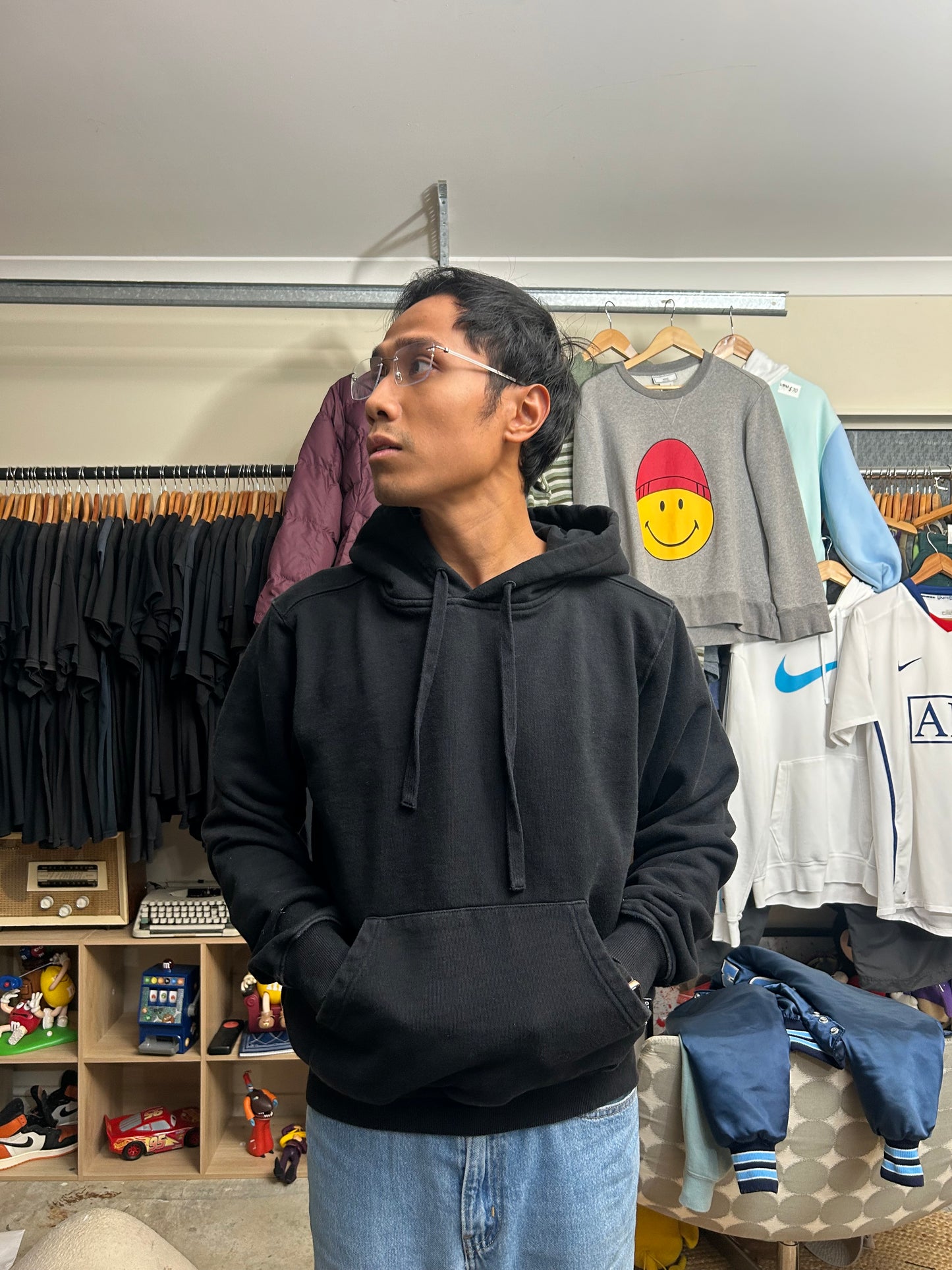 black Subtype Curated hoodie features a prominent kangaroo pocket and a clean, minimalist design Small