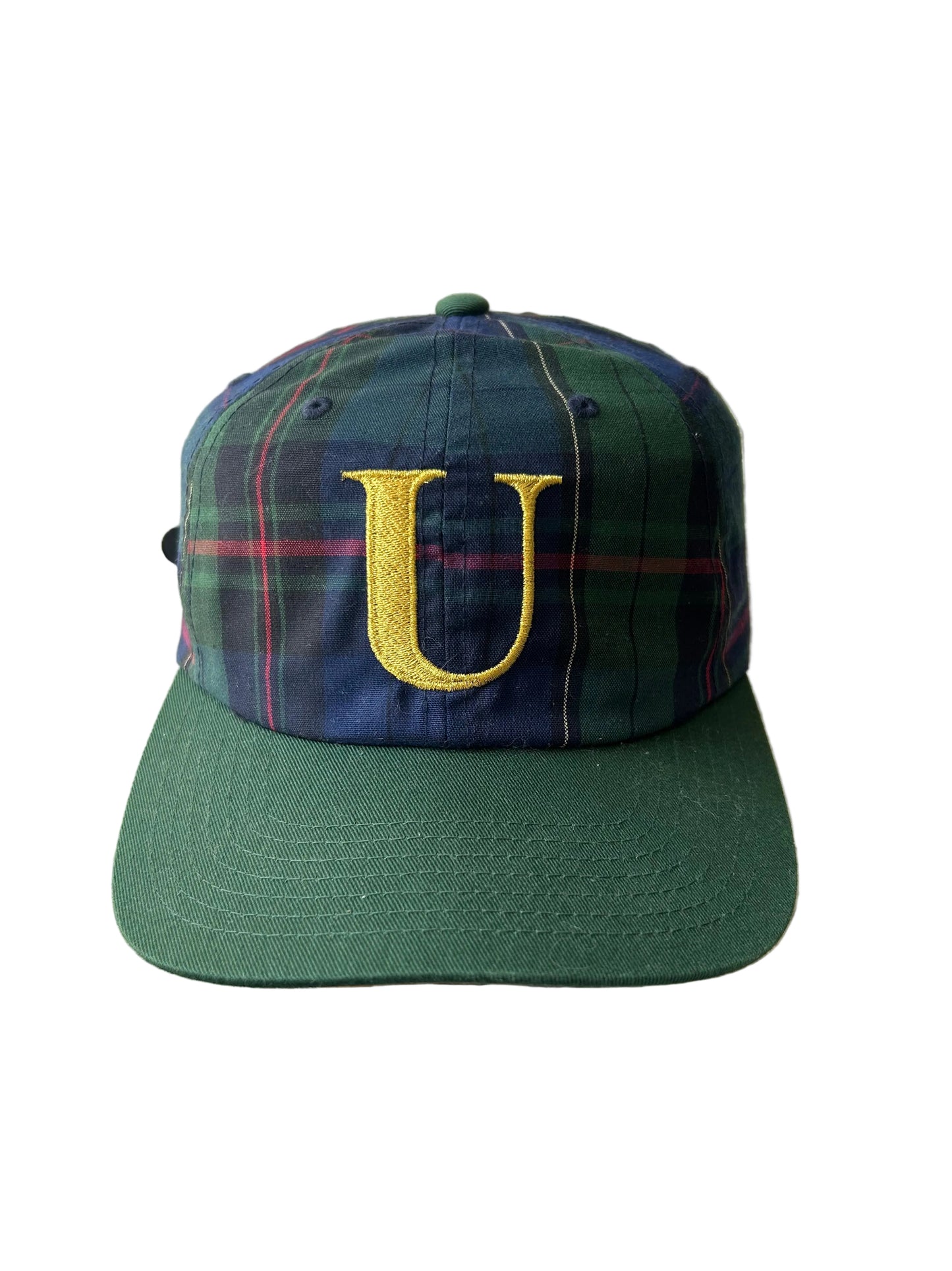 green and plaid Undefeated cap with a yellow embroidered "U" logo. Adjustable