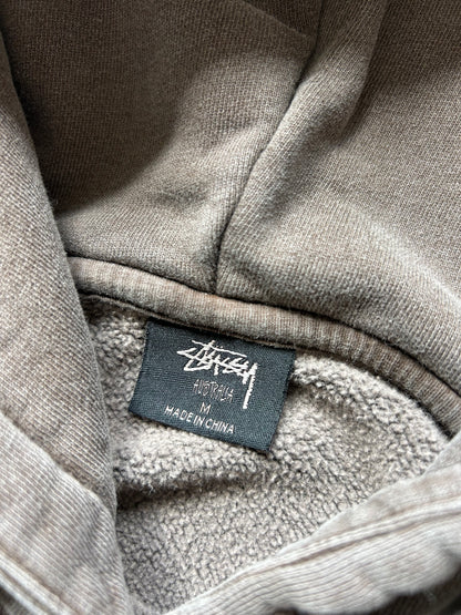 Stüssy 8 Ball Pigment Dyed Hoodie in a brown/taupe color, made from heavy cotton fleece