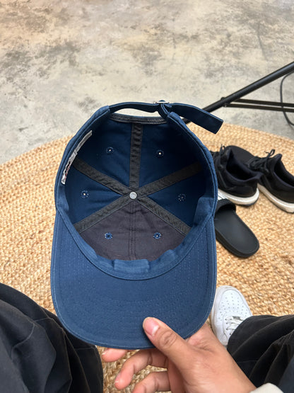 Vintage blue Nike cap featuring an embroidered gold swoosh logo Osfa