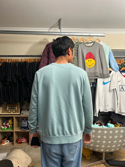 green Nike Men's Sportswear Club Fleece Crew features a classic embroidered logo on the chest Large