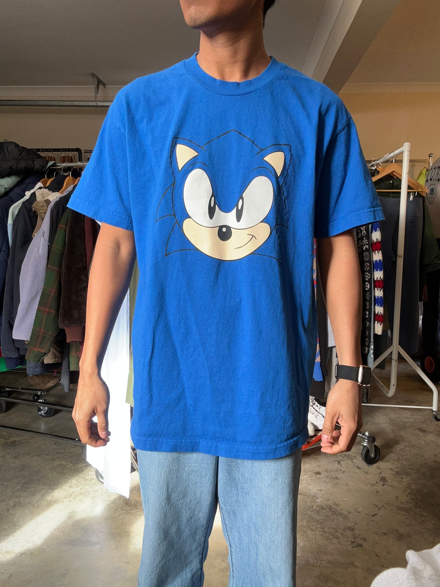 Large blue Sonic the Hedgehog t-shirt features a large graphic of Sonic's face on the front