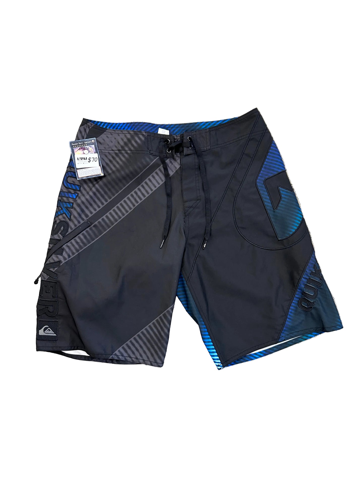Quiksilver board shorts featuring a black and blue design with diagonal striped detailing size 32