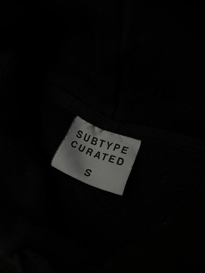 black Subtype Curated hoodie features a prominent kangaroo pocket and a clean, minimalist design Small