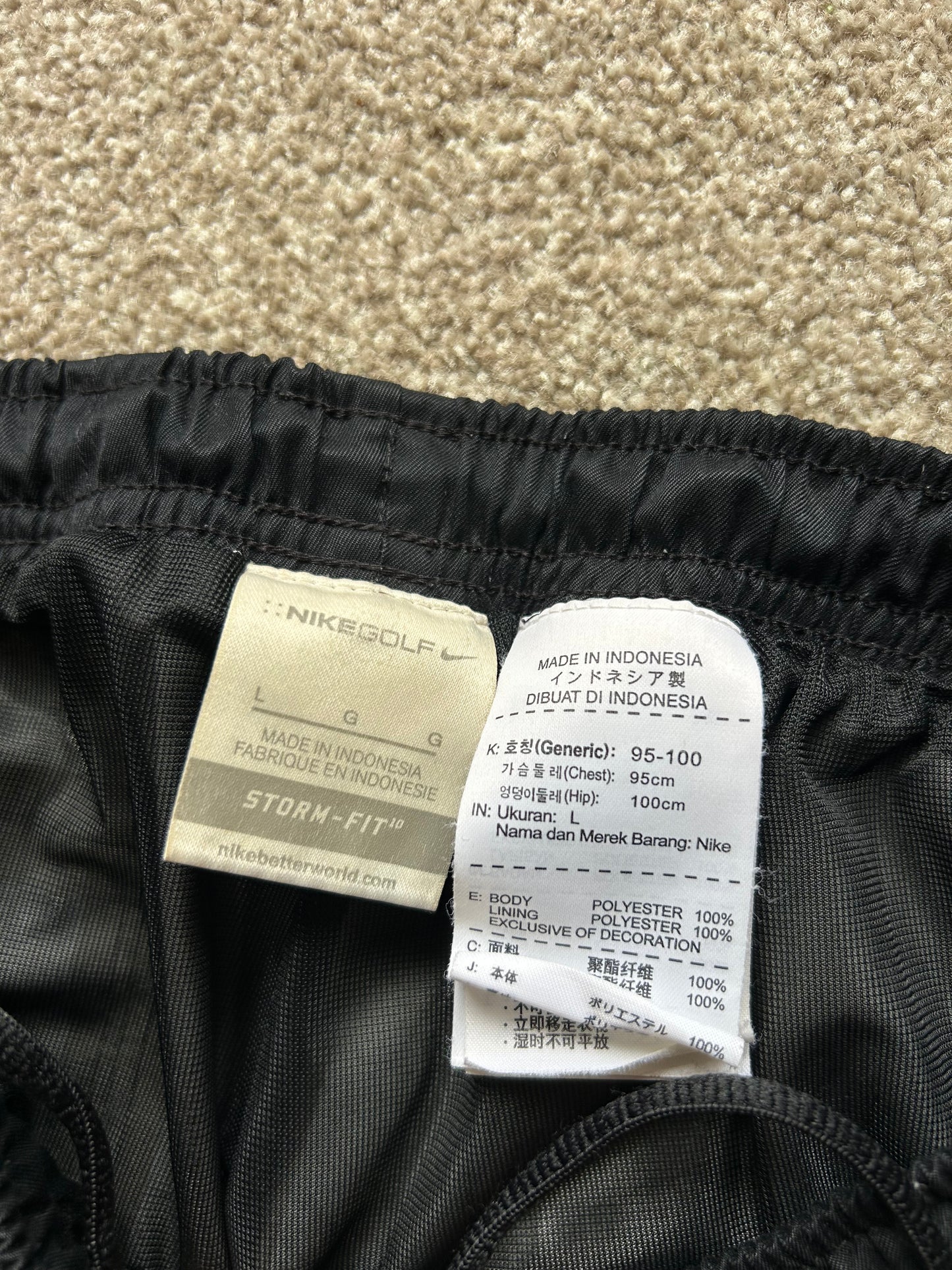 pair of black Nike Storm-FIT men's golf pants Size Large 32-34