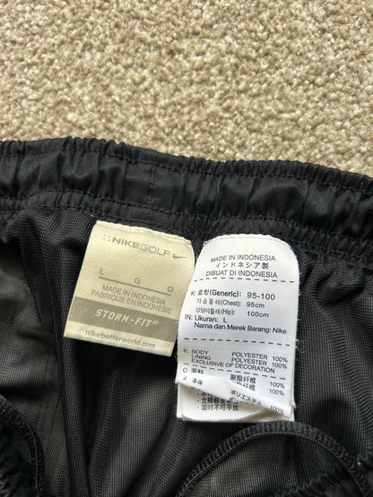 pair of black Nike Storm-FIT men's golf pants Size Large 32-34