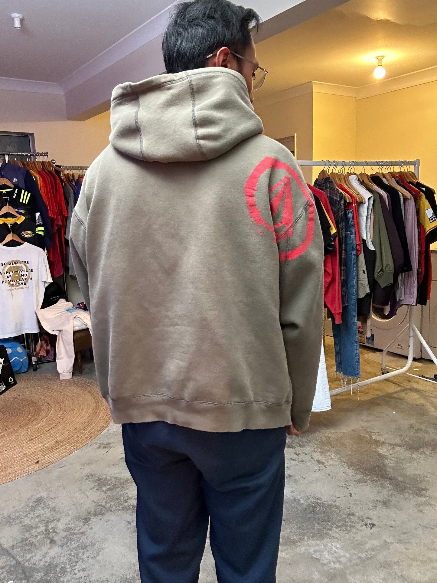 Vintage Y2K Volcom hoodie featuring a red and white graphic logo on the chest and text on the sleeve Army Green Faded