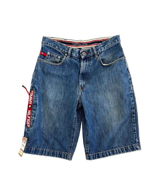 Vintage Tommy Hilfiger denim jean shorts feature a prominent logo tape side stripe size 32